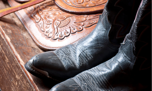 Cowboy boots, a belt buckle and jeans.